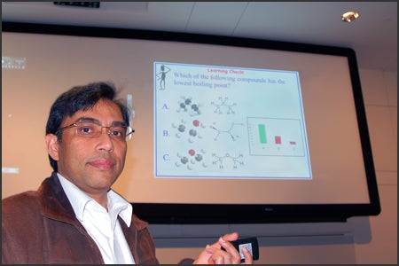 Dr. Dutta with a slide showing a question, possible responses and response distribution.